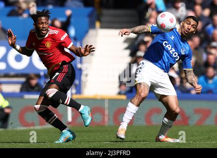 Liverpool, England, 9th April 2022.   Allan of Everton challenges Fred of Manchester United during the Premier League match at Goodison Park, Liverpool. Picture credit should read: Darren Staples / Sportimage Stock Photo