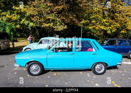 Bucharest, Romania, 24 October 2021: Old vivid blue Romanian Dacia 1300 classic car in traffic in the city center, in a sunny autumn day Stock Photo