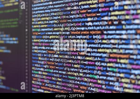 Web programming with Javascript. Examining compressed code Stock Photo