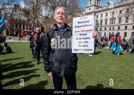 London, UK 9th April 2022. UK trade unions rally in solidarity with Ukraine. Human Rights campaigner, Peter Tatchell joins the march in Parliament Square. Stock Photo