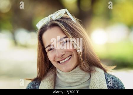 Looking pretty in the park. Cropped portrait of an attractive young woman spending a day in the park. Stock Photo