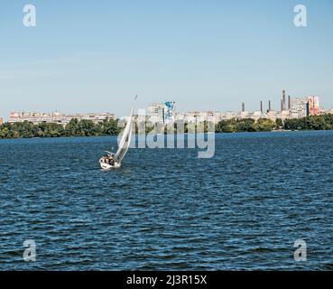 Sailing yacht on the Dnieper river in windy weather. Stock Photo