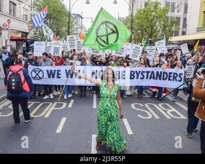 London, UK. 9th April 2022. Protesters in Oxford Street. Thousands of Extinction Rebellion protesters marched through central London and blocked the streets, calling on the government to end fossil fuels and act on climate change. Credit: Vuk Valcic/Alamy Live News Stock Photo