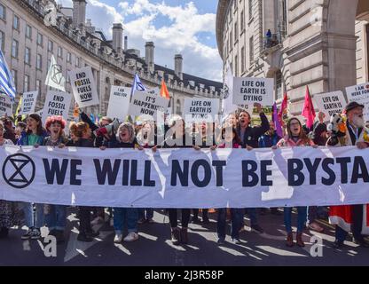 London, UK. 9th April 2022. Protesters in Regent Street. Thousands of Extinction Rebellion protesters marched through central London and blocked the streets, calling on the government to end fossil fuels and act on climate change. Credit: Vuk Valcic/Alamy Live News Stock Photo