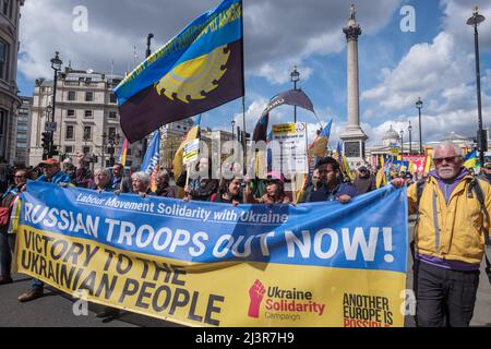 London, UK. 9th April 2022. On the march. Trade unionists and others in the Labour movement march from Parliament Square to a rally at Downing St demanding an end to Putin's war in Ukraine, withdrawal of Russian troops and making refugees welcome here. The Ukraine Solidarity Campaign protest was supported by Ukrainian trade union federations and UK unions including the GMB, PCS, CWU, ASLEF, NUM and  BFAWU. Peter Marshall/Alamy Live News Stock Photo