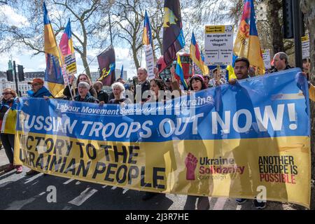 London, UK. 9th April 2022. On the march. Trade unionists and others in the Labour movement march from Parliament Square to a rally at Downing St demanding an end to Putin's war in Ukraine, withdrawal of Russian troops and making refugees welcome here. The Ukraine Solidarity Campaign protest was supported by Ukrainian trade union federations and UK unions including the GMB, PCS, CWU, ASLEF, NUM and  BFAWU. Peter Marshall/Alamy Live News Stock Photo