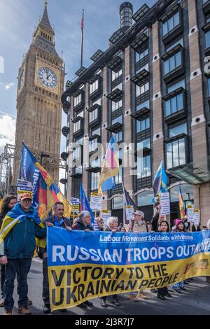 London, UK. 9th April 2022. On the march. Trade unionists and others in the Labour movement march from Parliament Square to a rally at Downing St demanding an end to Putin's war in Ukraine, withdrawal of Russian troops and making refugees welcome here. The Ukraine Solidarity Campaign protest was supported by Ukrainian trade union federations and UK unions including the GMB, PCS, CWU, ASLEF, NUM and  BFAWU. Peter Marshall/Alamy Live News Stock Photo