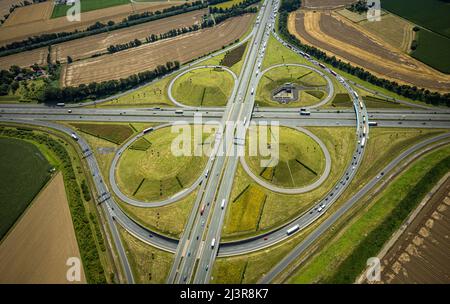 Aerial view, Kamener intersection with motorway A1 and motorway A2, helicopter sculpture Yellow Angel in inner circle, Kamen, Ruhr area, North Rhine-W Stock Photo