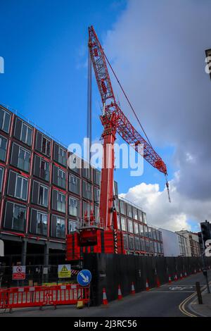 Red Tower Crane, construction in Liverpool City Centre Stock Photo