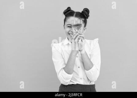 be hydrated. kid hold glass of mineral water. child feel thirsty. Stock Photo