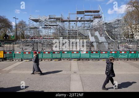 London, UK. 09th Apr, 2022. Pedestrians walk past the dismounting Marble Arch Mound. The Marble Arch Mound, costs £6 million to built, is being dismounted after major disappointment and widespread mockery on social media. Credit: SOPA Images Limited/Alamy Live News Stock Photo