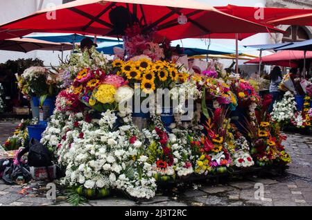 The Cuenca Flowers Market, a vibrant and colorful marketplace located in the city of Cuenca, Ecuador. Stock Photo