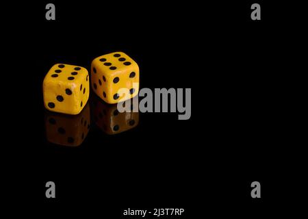Gambling. Two dice on a black background with reflection Stock Photo