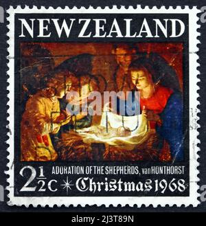 NEW ZEALAND - CIRCA 1968: a stamp printed in the New Zealand shows Adoration of the Holy Child, Painting by Gerard van Honthorst, Christmas, circa 196 Stock Photo