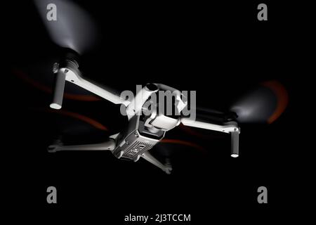 Nürtingen, Germany - June 26, 2021: Drone dji air 2s. Isolated on black. Illuminated with 1 flash at night. Side up view. Stock Photo