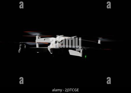 Nürtingen, Germany - June 26, 2021: Drone dji air 2s from behind. Isolated on black. Illuminated with 1 flash at night. Stock Photo