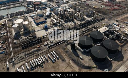 An aerial view above the Hamilton Bayfront Industrial area on a sunny day; an asphalt production and chemicals plant are pictured below. Stock Photo