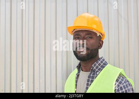 Portrait of smiling construction worker wearing hardhat Stock Photo