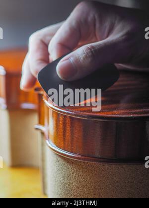 luthier working on a new violin in his workshop Stock Photo