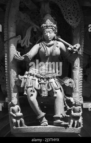 Stone Sculpture of Beautiful Female (Madanikas) with selective focus, 12th century Hindu temple, Ancient stone art and sculptures in each pillars, Che Stock Photo