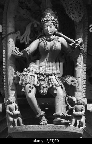 Stone Sculpture of Beautiful Female (Madanikas) with selective focus, 12th century Hindu temple, Ancient stone art and sculptures in each pillars, Che Stock Photo