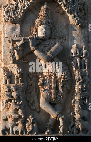 Stone Sculpture of Beautiful Female (Madanikas) with selective focus, 12th century Hindu temple, Ancient stone art and sculptures in each pillars, Che Stock Photo