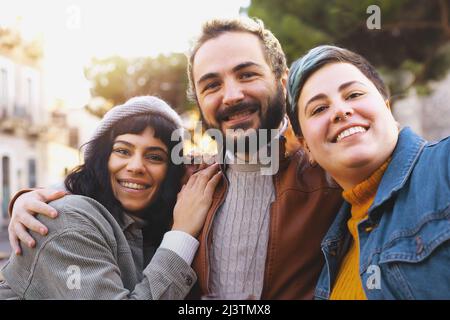 Group of cheerful best friends having fun looking at the camera portrait Stock Photo