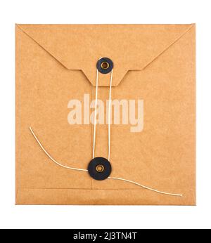 top view closeup of closed square vintage craft paper envelope with textile thread enclosing isolated on white background Stock Photo