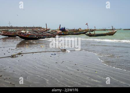 Fishermen and boats on the Tanji coast in the Gambia west Africa Stock Photo