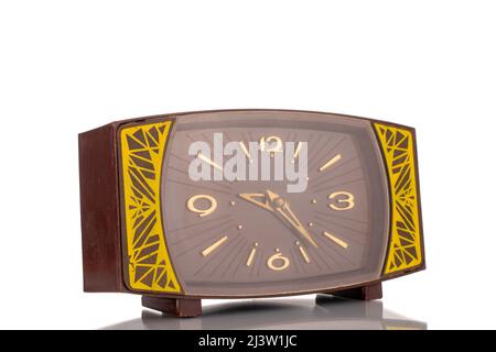 One old mechanical alarm clock, close-up, isolated on a white background. Stock Photo