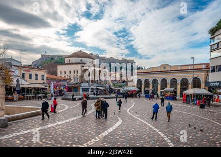 Monastiraki Square, with the Tzistarakis Mosque on the left, the metro station on the right and the Acropolis in the background. Athens, Greece. Stock Photo