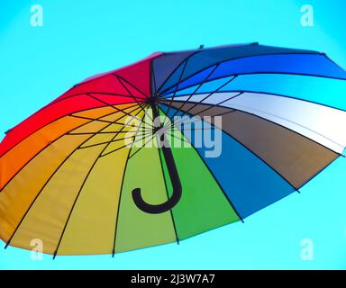 Isolated opened umbrella in rainbow colours Stock Photo