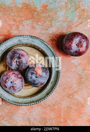 Dish of Fresh Plums Stock Photo
