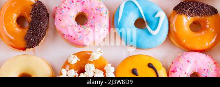 sweet doughnuts on gray stone background Stock Photo