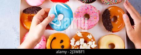 sweet doughnuts on gray stone background Stock Photo