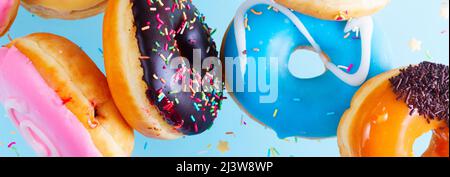 flying doughnuts on blue Stock Photo