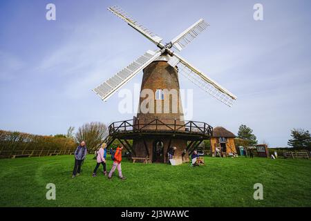 Wilton windmill, Wiltshire, where members of the Wilton Windmill Society are helping to complete the annual Spring clean of the traditional tower mill with fantail, built in 1871 and operational for 100 years. Picture date: Sunday April 10, 2022. Stock Photo