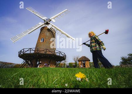 Wilton windmill, Wiltshire, where members of the Wilton Windmill Society are helping to complete the annual Spring clean of the traditional tower mill with fantail, built in 1871 and operational for 100 years. Picture date: Sunday April 10, 2022. Stock Photo