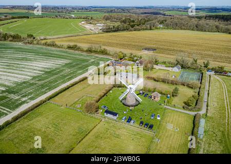 Wilton windmill, Wiltshire, where members of the Wilton Windmill Society are helping to complete the annual Spring clean of the traditional tower mill with fantail, built in 1871 and operational for 100 years. Picture date: Sunday April 10, 2022. Stock Photo