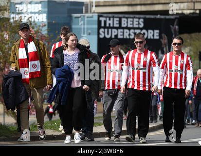London, UK. 10th Apr, 2022. Brentford fans arrive ahead of the Premier League match at Brentford Community Stadium, London. Picture credit should read: Paul Terry/Sportimage Credit: Sportimage/Alamy Live News