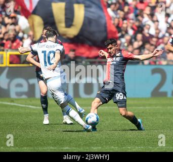 Genoa, Italy. 30 April 2022. Antonio Candreva of UC Sampdoria competes for  the ball with Pablo Galdames of Genoa CFC during the Serie A football match  between UC Sampdoria and Genoa CFC.