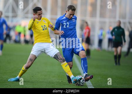 Alexandru Cimpanu #10 and Julius Tauriainen #22 in in Friendly game between Romania U21 and Finland U21 , 25.03.2022 ,Arcul de Triumf Stad , Bucharest Stock Photo