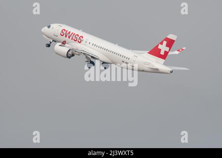 Zurich, Switzerland, March 2, 2022 Swiss International Airlines Bombardier CS-100 or A220 leaving from runway 28 Stock Photo