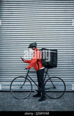 Navigating his way to his next delivery Stock Photo