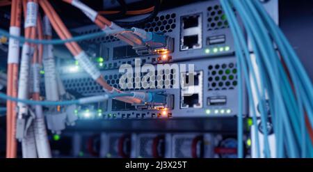 Network cables and hub closeup with fiber optical 6G Stock Photo