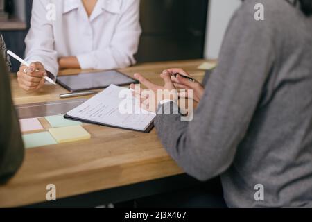 group of employees discussing a new business plan. close-up. Stock Photo