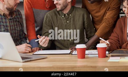 business man explaining something to his colleagues . Stock Photo