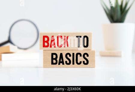 back to basics word written on wood block. back to basics text on table, concept Stock Photo