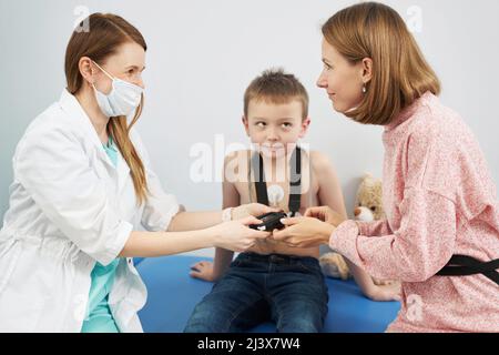 Doctor checking child heart rhythm with ECG holter monitor Stock Photo ...