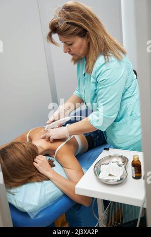 Female patient having carboxytherapy procedure in clinic Stock Photo